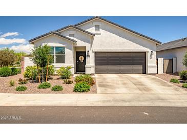 Charming single-story home featuring a two-car garage and welcoming front yard at 1482 W Gloucester W Rd, San Tan Valley, AZ 85143