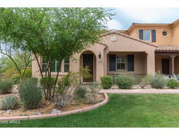 Charming single-Gathering home with a well-manicured lawn, desert landscaping, and inviting front porch at 18550 N 94Th St, Scottsdale, AZ 85255