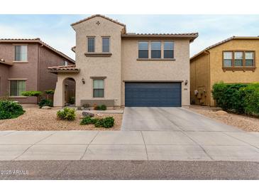 Charming two-story home featuring a well-maintained yard with low-water landscaping at 2533 W Cordia Ln, Phoenix, AZ 85085
