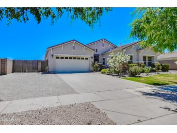 Inviting single-Gathering home featuring a three-car garage and beautiful landscaping in a suburban setting at 2813 E Crescent Way, Gilbert, AZ 85298