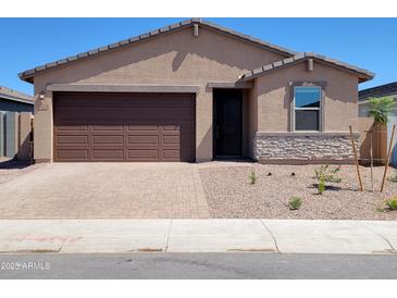 Charming single-story home with a brown garage door, desert landscaping, and a welcoming front entrance at 4182 W Lisa Ln, San Tan Valley, AZ 85144