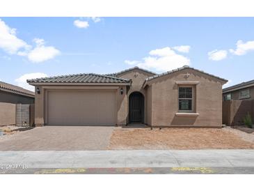 Charming single-story home with a two-car garage and desert landscaping in a sunny neighborhood at 13503 W Calle De Baca --, Peoria, AZ 85383