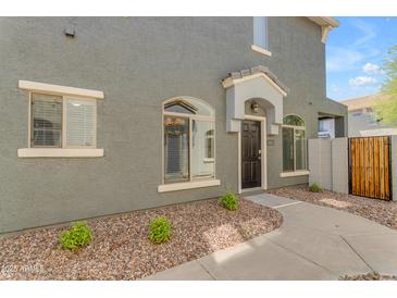Charming townhome features a covered front door and well-maintained landscaping at 2402 E 5Th St # 1621, Tempe, AZ 85288