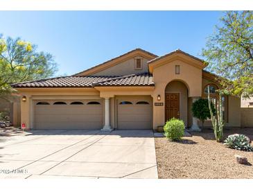 Charming single-story home with a three-car garage and well-maintained desert landscaping at 10287 E Verbena Ln, Scottsdale, AZ 85255
