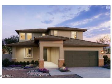 Beautiful two-story home with a two-car garage and inviting front entrance at 25351 W Bowker St, Buckeye, AZ 85326