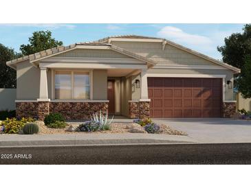 Charming single-story home with stone accents, covered porch, two-car garage and landscaped front yard at 25736 N 159Th Ln, Surprise, AZ 85387