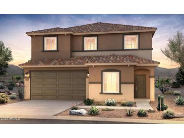 Charming two-story home features a two-car garage, tiled roof, and desert landscaping for a clean, modern aesthetic at 5041 S 252Nd Ave, Buckeye, AZ 85326