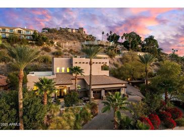 Beautiful, multi-story home with well-manicured landscaping and a paved driveway at 7631 N 20Th St, Phoenix, AZ 85020