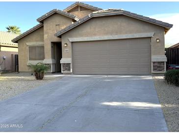 Charming single-Gathering home with a neutral-colored exterior, two-car garage, and low-maintenance front yard at 4582 E Superior Rd, Queen Creek, AZ 85143