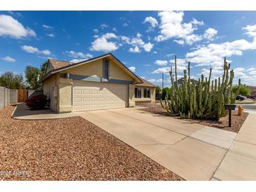 Charming home with two-car garage, desert landscaping and front yard fire hydrant at 7302 W Meadowbrook Ave, Phoenix, AZ 85033