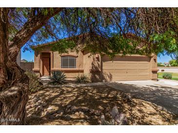 Charming single-story home with desert landscaping and a two-car garage at 2024 E Dust Devil Dr, San Tan Valley, AZ 85143