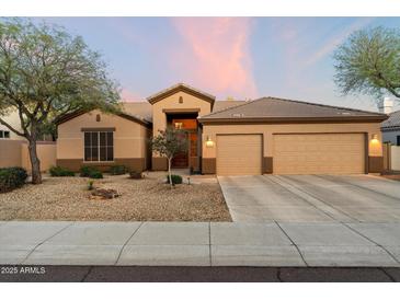 Charming single-story home with a neutral color palette, well-maintained landscaping, and a convenient two-car garage at 22231 N 55Th St, Phoenix, AZ 85054