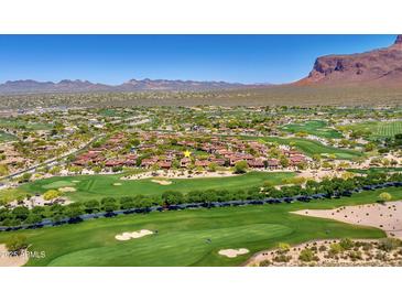 Stunning aerial view of golf course community with mountain views and beautiful desert landscaping at 7780 E Golden Eagle Cir, Gold Canyon, AZ 85118