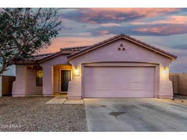 Charming single-story home with a two-car garage and low maintenance gravel landscaping at 9704 W Cordes Rd, Tolleson, AZ 85353