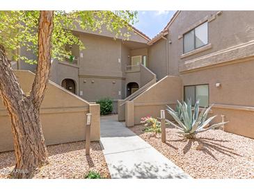 Charming multi-level home with desert landscaping and unique architectural design at 15225 N 100Th St # 1209, Scottsdale, AZ 85260