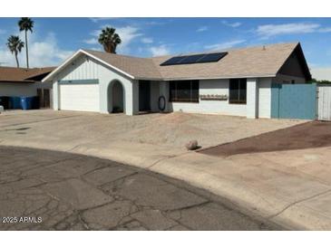 Charming single-story home featuring solar panels, a two-car garage, and low maintenance landscaping at 12836 N 39Th Ln, Phoenix, AZ 85029
