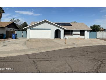 Charming single-story home features a two-car garage, landscaped front yard, and solar panels at 12836 N 39Th Ln, Phoenix, AZ 85029