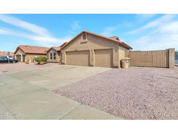 Charming single-story home featuring a well-maintained yard and a spacious two-car garage at 6102 W Shangri La Rd, Glendale, AZ 85304