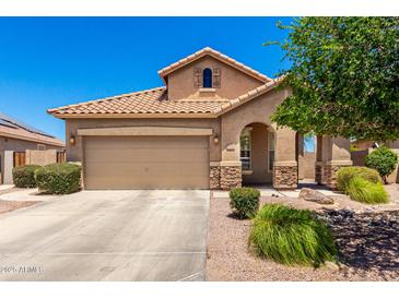 Charming single-Gathering home featuring a tile roof and a welcoming two-car garage in a well-maintained neighborhood at 6557 S Classic Way, Gilbert, AZ 85298