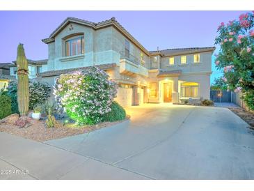 Charming two-story home features a well-maintained yard with lush landscaping and a welcoming entrance at 17009 S Coleman St, Phoenix, AZ 85045
