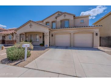 Inviting two-story home featuring a well-maintained front yard and a convenient three-car garage at 2911 W Keim Dr, Phoenix, AZ 85017