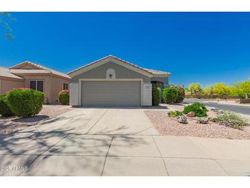 Charming single-story home featuring a well-maintained front yard and a two-car garage at 30440 N 42Nd Pl, Cave Creek, AZ 85331