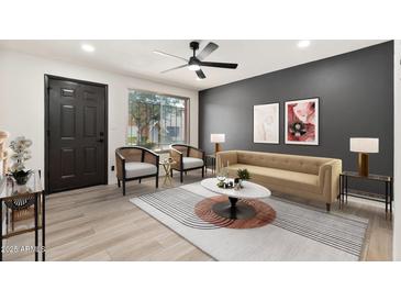 Comfortable living room featuring modern furnishings, stylish decor, and lots of natural light at 6556 N 43Rd Ave, Glendale, AZ 85301