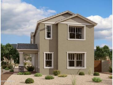 Charming two-story home with tan stucco, decorative roofline, and welcoming covered porch at 1913 W Lariat Ln, Phoenix, AZ 85085
