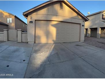 Charming home with a detached garage, ample driveway space, and a private gated entrance at 921 S Val Vista Dr # 28, Mesa, AZ 85204