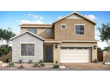 Charming two-story home featuring a stacked stone accent wall and a two-car garage at 1450 E Prescott St, Gilbert, AZ 85298
