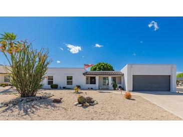 Charming single-story home featuring xeriscape landscaping and a welcoming front entrance at 14616 N 28Th Pl, Phoenix, AZ 85032