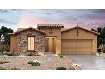 Charming single-Gathering home featuring a stone facade, tile roof, desert landscaping, and a two-car garage at 20157 W San Miguel Ave, Litchfield Park, AZ 85340