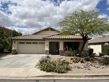 Charming single-story home with a desert landscaped front yard and a two-car garage at 830 E Dry Creek Rd, San Tan Valley, AZ 85143