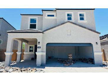 Two-story home featuring a covered entryway and a spacious garage at 5041 E Umber Rd, San Tan Valley, AZ 85143