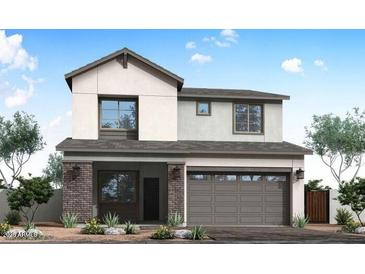 Charming two-story home featuring a modern design, two-car garage, and manicured landscaping at 1549 E Eleana Ln, Gilbert, AZ 85298