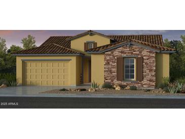 Charming single-Gathering home featuring a two-car garage and stone accents for an attractive facade at 16923 W Canterbury Dr, Surprise, AZ 85388