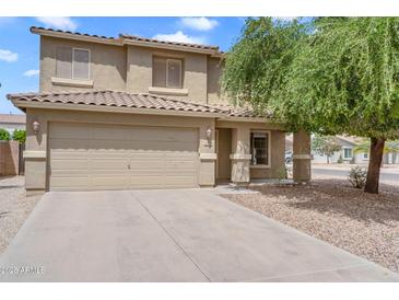 Charming two-story home with a two-car garage and easy to maintain desert landscaping at 1754 E Bradstock Way, San Tan Valley, AZ 85140