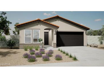 Charming single-story home with a two-car garage and desert landscaping, featuring a tiled roof and neutral paint at 17995 W Sand Hills Rd, Surprise, AZ 85387
