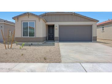 Charming single-Gathering home with a two-car garage and low maintenance desert landscaping at 18009 W Sand Hills Rd, Surprise, AZ 85387