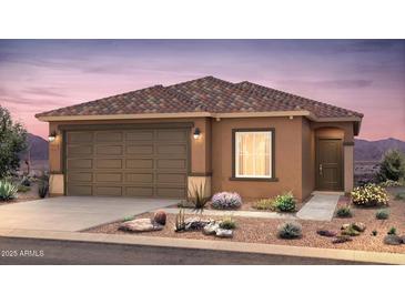 Beautiful single-story home featuring a brown exterior, attached garage and desert landscaping at 25176 W Wier Ave, Buckeye, AZ 85326