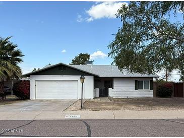 Charming single-story home featuring a two-car garage and a well-maintained front yard at 3150 E Corrine Dr, Phoenix, AZ 85032