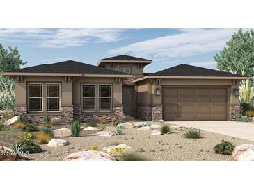 Inviting single story home with beautiful desert landscaping and a two car garage at 32497 N 135Th Dr, Peoria, AZ 85383