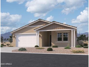 Charming single-story home featuring a two-car garage and a welcoming covered entry at 9539 W Parkway Dr, Tolleson, AZ 85353