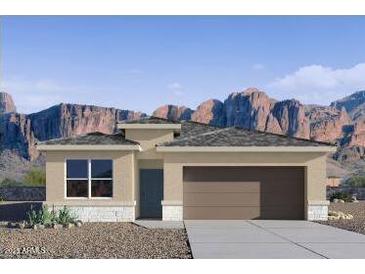 Inviting single-story home boasting a neutral palette, attached two-car garage, and mountain views at 10620 W Sonrisas St, Tolleson, AZ 85353