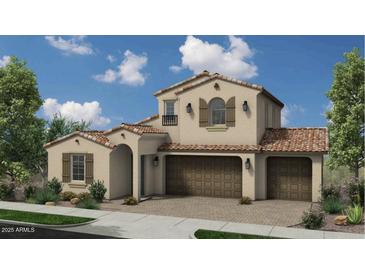 Charming two-story home featuring a tile roof, three-car garage, and manicured landscaping at 13159 N 153Rd Ave, Surprise, AZ 85379