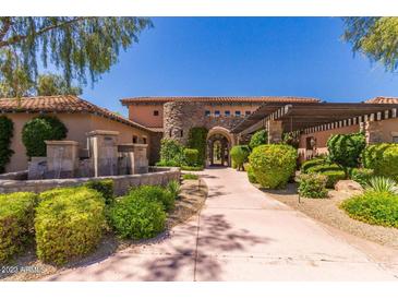 Beautiful stucco home featuring desert landscaping and a stone fountain entrance and a tiled roof at 20660 N 40Th St # 2016, Phoenix, AZ 85050