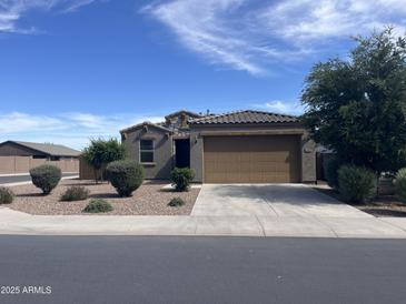 Charming single-story home featuring a neutral color palette, two-car garage, and well-maintained landscaping at 4490 W Horsenettle Dr, San Tan Valley, AZ 85144