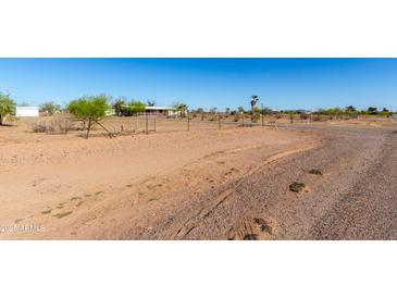 Ranch-style home with desert landscaping, featuring a cozy porch and spacious yard at 3747 S Mammoth Dr, Casa Grande, AZ 85193