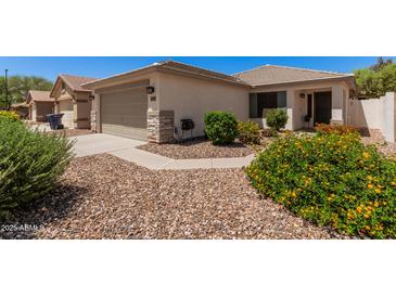 Charming single-story home featuring desert landscaping and a two-car garage at 4262 E Sundance Ave, Gilbert, AZ 85297