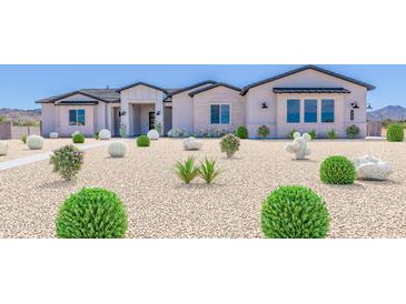 Charming single-story home featuring desert landscaping, a stucco facade, and a welcoming entrance at 6604 W Apex Ave, Queen Creek, AZ 85144